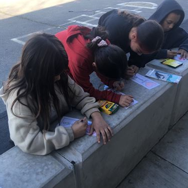 a group of students coloring